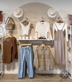 clothes and hats on display in a clothing store