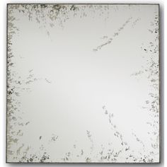 a square mirror with white paint on it