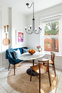 a living room with two chairs and a table