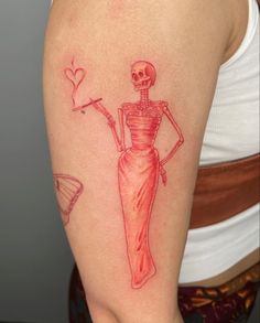 a woman with a skeleton tattoo on her arm