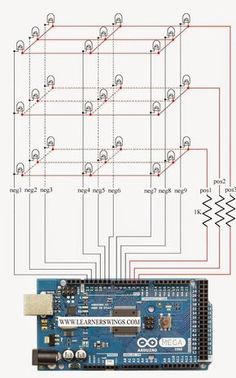 the circuit board is connected to an electronic device with several red dots on it and two wires