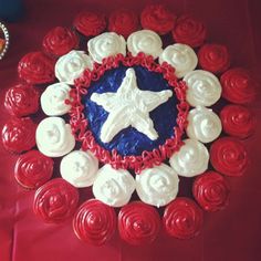 red, white and blue cupcakes arranged in the shape of a star