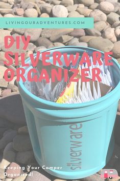 a blue trash can filled with silverware on top of a rock covered ground and text overlay that reads diy silverware organizer keeping your campers organized