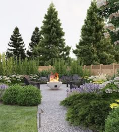 a fire pit in the middle of a garden