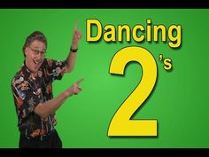 a man is dancing in front of a green background with the words dancing's 2