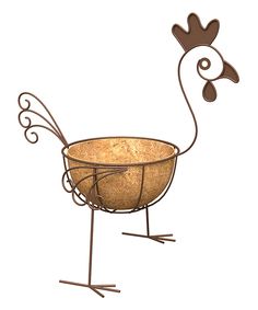 a metal bird with a basket on it's feet