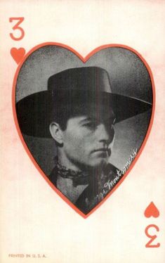 a man wearing a cowboy hat in a heart - shaped card with the number 3 on it