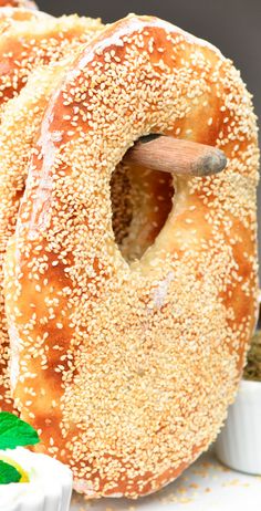 sesame seed bagels with dips on the side