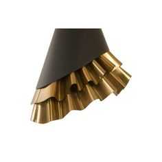 a black and gold lamp shade on a white background