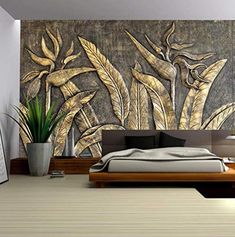 a bed room with a large painting on the wall