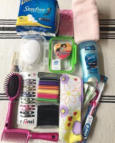 the contents of a personal care kit laid out on top of a towel and tablecloth