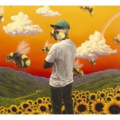 a man standing on top of a field of sunflowers with bees flying over him