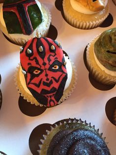 star wars cupcakes are decorated with frosting