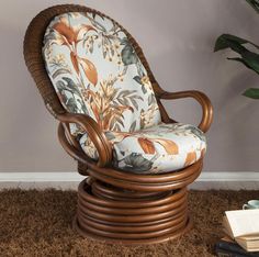 a chair that is sitting on the floor next to a potted plant and books