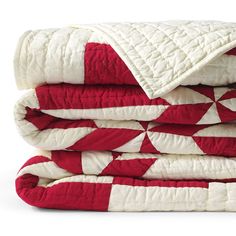 three red and white quilts stacked on top of each other in the same pattern