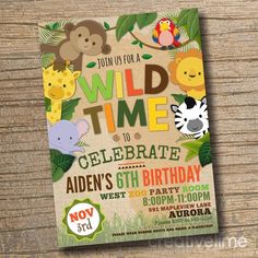 the wild time birthday party is set up on a wooden table with an animal theme