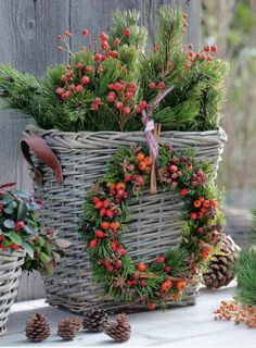 a basket filled with pine cones and berries