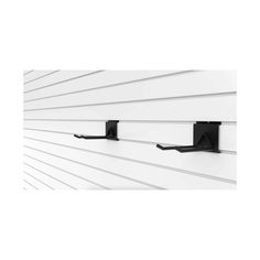 two black brackets mounted to the side of a white wall with horizontal lines on it