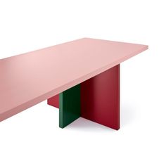 a pink table with two green and red sections on the top, against a white background