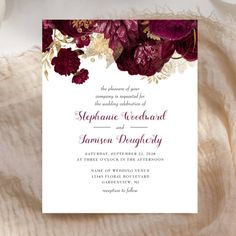 a wedding card with burgundy flowers on it