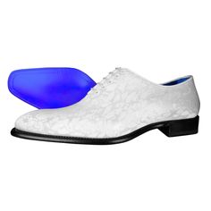 a pair of white shoes with blue soles