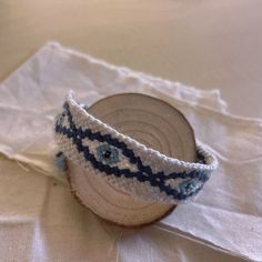 a crocheted headband sitting on top of a white cloth