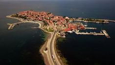 an aerial view of a small town by the water