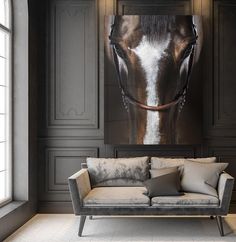 a living room filled with furniture and a horse painting on the wall above it's head