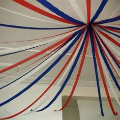 red, white and blue streamers hanging from the ceiling