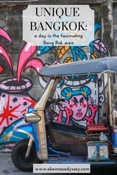 an old car parked in front of a graffiti covered wall with the words unique bangkok written on it