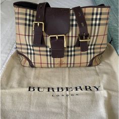 Burberry Classic Large Tote With Buckle Bag. You Can Either Use It As Shoulder Bag Or Just Like A Carry On Bag. It’s In A Very Clean And Perfect Condition. 100% Authentic Guaranteed! Includes A Very Clean Dust Bag. Measurements: Length - 15” Height - 10” Width - 7” Strap Drop - 8.75” Condition: Good Used Condition. Shows Very Very Very Light Wear. The Handles Are Relaxed. Interior Shows No Marks And Wear It Very Clean. Tons Of Life! Best Offer Accepted Burberry Handbags Classic, Offer Accepted, Buckle Bag, Burberry Classic, Buckle Bags, Bag Measurements, Burberry London, Carry On Bag, Large Tote