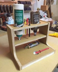 a wooden shelf with various tools on it