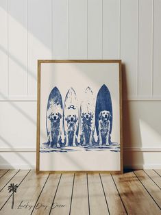 three dogs standing in front of surfboards on the beach, one is blue and white