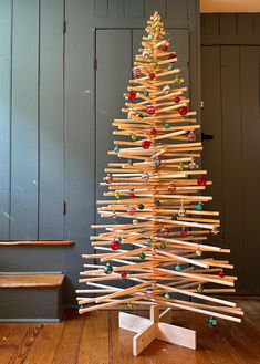 a christmas tree made out of wooden sticks