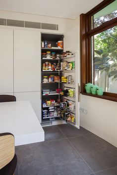 an open pantry with lots of food in it