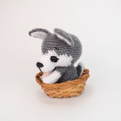 a crocheted stuffed animal sitting in a basket