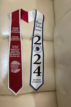 two red and white neck ties on a chair