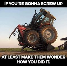 a tractor that is sitting on the ground with its wheels in it's tires