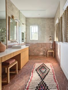 a bathroom with a rug on the floor