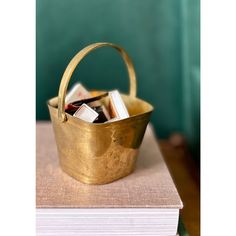 a basket full of books sitting on top of a table