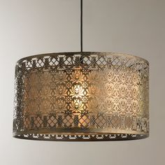 a chandelier hanging from the ceiling with an intricate design in gold and silver