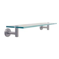 a glass shelf with metal brackets on it