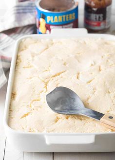 a spoon in a baking dish with batter