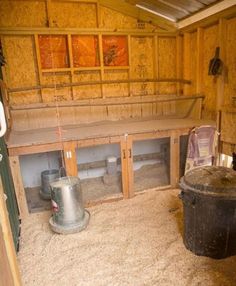 the inside of a wooden building with lots of storage