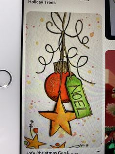 an ornament hanging from a christmas tree with stars and confetti on it