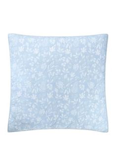 a light blue pillow with white flowers on the front and back, against a white background