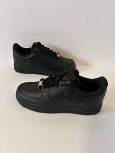 Elevate your sneaker game with these Nike Air Force 1 '07 Triple Black sneakers, perfect for any occasion. These shoes are designed with a low top shoe shaft style and standard shoe width, featuring a lace-up closure for a secure fit. The black color and colorful theme add a touch of elegance, making them a perfect fit for your activewear, casual wear, and workwear wardrobe. These sneakers are a women's size 8.5 with a UK shoe size of 6 and an EU shoe size of 40. They are part of the Nike Air Fo Shoes Black Women Sneakers, Black Af1s Outfit, All Black School Shoes, Nike Air Force 1 Black Casual, Casual Black Nike Air Force 1, Black Synthetic Nike Air Force 1 Casual Shoes, Black Casual Nike Air Force 1 Synthetic, Casual Black Nike Air Force 1 Synthetic, Black Shoes Outfit Sneakers