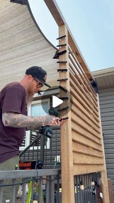 a man is working on a wooden structure