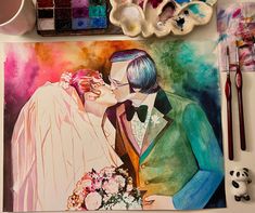 a painting of a bride and groom kissing on their wedding day with paintbrushes next to them