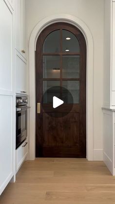 a wooden door in the middle of a kitchen